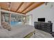 Cozy bedroom featuring a view of the pool area through large glass windows at 605 Sweetbriar Rd, Orlando, FL 32806