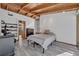 Bright bedroom with wood-beamed ceiling, tile floors, and ample natural light at 605 Sweetbriar Rd, Orlando, FL 32806