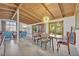 Inviting dining room featuring a wood beamed ceiling and an adjacent living room with comfortable seating at 605 Sweetbriar Rd, Orlando, FL 32806