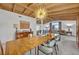 Open dining room with a long wood table, modern chairs, and beautiful wood accents at 605 Sweetbriar Rd, Orlando, FL 32806