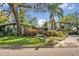 Charming single-Gathering home with mature landscaping, a lush green lawn, and inviting curb appeal at 605 Sweetbriar Rd, Orlando, FL 32806
