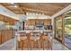 Cozy kitchen features a breakfast bar, stainless steel appliances, and ample counter space at 605 Sweetbriar Rd, Orlando, FL 32806