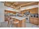 Bright kitchen features wood cabinets, a large island with seating, and a unique wood-beamed ceiling with skylights at 605 Sweetbriar Rd, Orlando, FL 32806