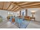 Sun-filled living area with vaulted wood ceilings, hardwood floors, and modern decor at 605 Sweetbriar Rd, Orlando, FL 32806