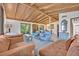 Open concept living room featuring vaulted ceilings, neutral colors and a view into the dining area at 605 Sweetbriar Rd, Orlando, FL 32806