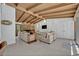 Open living room boasts a beamed ceiling, a stone fireplace and an expansive seating area at 605 Sweetbriar Rd, Orlando, FL 32806