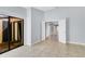 Spacious living room with tile floors, neutral walls, and backyard access at 626 Golden Sunshine Cir, Orlando, FL 32807