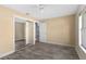 Bedroom with tiled floors and closet with mirror doors at 649 Caribou Ct, Poinciana, FL 34759