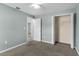 Comfortable bedroom features closet space, neutral walls, and access to other rooms at 649 Caribou Ct, Poinciana, FL 34759
