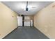 Functional garage space includes a washer, dryer, water heater, and additional storage at 649 Caribou Ct, Poinciana, FL 34759