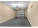 Spacious garage with ample storage space and overhead door at 649 Caribou Ct, Poinciana, FL 34759