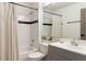Well-lit bathroom featuring a shower-tub combination and modern fixtures at 660 Celebration Ave # 220, Celebration, FL 34747