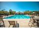 Inviting community pool area with lounge chairs, shaded umbrellas and well-maintained landscaping creating a relaxing atmosphere at 660 Celebration Ave # 220, Celebration, FL 34747