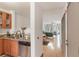 View of the kitchen with granite countertops and an open floorplan leading to the living room at 660 Celebration Ave # 220, Celebration, FL 34747
