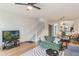 Inviting living room with modern furnishings, wood floors, and access to the staircase at 660 Celebration Ave # 220, Celebration, FL 34747