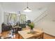 Bright living room featuring stairs, hardwood floors, neutral decor, and lots of natural light at 660 Celebration Ave # 220, Celebration, FL 34747