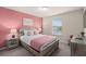 Cozy bedroom with a queen size bed and soft lighting provides a peaceful retreat at 7180 Oakmoss Loop, Davenport, FL 33837