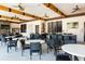 Community center with outdoor kitchen, dining areas, and televisions for socializing and entertainment at 7180 Oakmoss Loop, Davenport, FL 33837