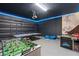 Fun game room with foosball, ping pong, and air hockey provides hours of entertainment at 7180 Oakmoss Loop, Davenport, FL 33837