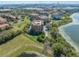 Beautiful aerial shot features residential buildings with lake views and well-maintained green spaces at 7508 Toscana Blvd # 123, Orlando, FL 32819