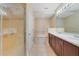 Bathroom with glass shower, bath tub, double sinks, and tile flooring at 7508 Toscana Blvd # 123, Orlando, FL 32819