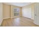 Bedroom featuring hardwood floors, closet and window for natural light at 7508 Toscana Blvd # 123, Orlando, FL 32819