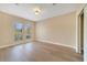 Neutral-toned bedroom featuring light walls and two sunny windows at 7508 Toscana Blvd # 123, Orlando, FL 32819