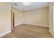 Bedroom featuring hardwood floors and plenty of natural light at 7508 Toscana Blvd # 123, Orlando, FL 32819