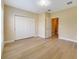 Bedroom featuring hardwood floors and closet for storage at 7508 Toscana Blvd # 123, Orlando, FL 32819