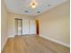 Bedroom featuring hardwood floors, closet with shelving and storage at 7508 Toscana Blvd # 123, Orlando, FL 32819