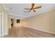 Another view of the spacious living room showcasing the kitchen passthrough at 7508 Toscana Blvd # 123, Orlando, FL 32819