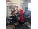 Bedroom containing home gym equipment. Cluttered and not optimized at 8124 Claire Ann Dr # 303, Orlando, FL 32825