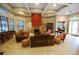 Spacious lobby with comfortable seating, a fireplace, and ample natural light for a welcoming atmosphere at 8124 Claire Ann Dr # 303, Orlando, FL 32825