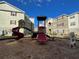 Community playground with slides and climbing structures, set against a backdrop of residential buildings at 8124 Claire Ann Dr # 303, Orlando, FL 32825