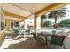 Covered patio overlooking the community pool, with tables and chairs for outdoor dining and relaxation at 8124 Claire Ann Dr # 303, Orlando, FL 32825