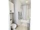 Bathroom with a shower-tub combination and a coordinating bath mat and towel at 860 N Orange Ave # 318, Orlando, FL 32801