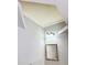 Bathroom featuring a large mirror, vanity lighting, and gray walls at 860 N Orange Ave # 318, Orlando, FL 32801