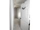 Bright bedroom doorway with a view of plush carpeting and a sheer-curtained window at 860 N Orange Ave # 318, Orlando, FL 32801