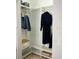 Organized closet with shelves, clothing racks, and convenient storage boxes at 860 N Orange Ave # 318, Orlando, FL 32801