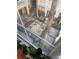 View of the well-maintained courtyard filled with lush landscaping, as seen from the window at 860 N Orange Ave # 318, Orlando, FL 32801