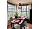 Elegant dining room with large windows, modern lighting, and hardwood floors at 860 N Orange Ave # 318, Orlando, FL 32801