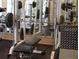 Fully equipped gym with weightlifting machines and mirrored walls, ideal for a comprehensive fitness routine at 860 N Orange Ave # 318, Orlando, FL 32801