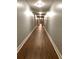 Long hallway with wood floors and recessed lighting at 860 N Orange Ave # 318, Orlando, FL 32801