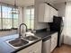 Kitchen with modern faucet and stainless steel appliances plus city view at 860 N Orange Ave # 318, Orlando, FL 32801