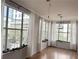 Light-filled living room featuring hardwood floors and large windows showcasing city views at 860 N Orange Ave # 318, Orlando, FL 32801