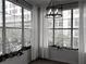 Sunlit living room with expansive windows, contemporary lighting, and modern décor at 860 N Orange Ave # 318, Orlando, FL 32801
