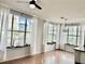 Bright living room with many windows and beautiful wood flooring at 860 N Orange Ave # 318, Orlando, FL 32801