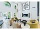 Open-concept living room with high ceilings, large windows, and contemporary furnishings at 860 N Orange Ave # 318, Orlando, FL 32801