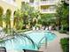 Relaxing community swimming pool with lounge chairs and tropical greenery, creating a resort-like atmosphere at 860 N Orange Ave # 318, Orlando, FL 32801