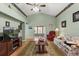 Inviting living room with vaulted ceilings and natural light, perfect for relaxation and entertaining at 912 Challenger Ave, Davenport, FL 33897